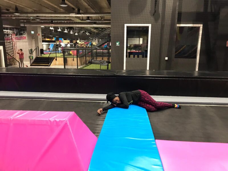 Lovette Jallow playing with Jeanine's children, providing them comfort and joy while Jeanine rests