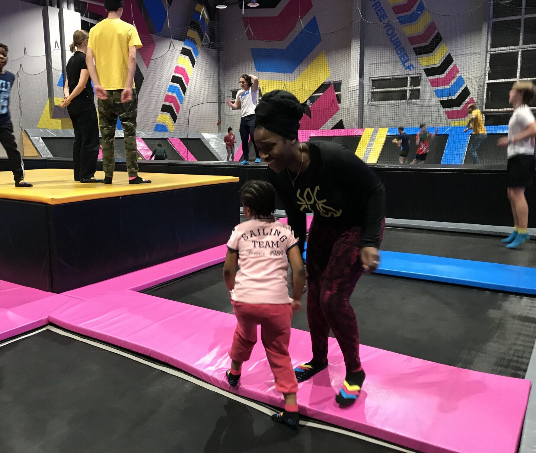 Lovette Jallow playing with Jeanine's children, providing them comfort and joy while Jeanine rests