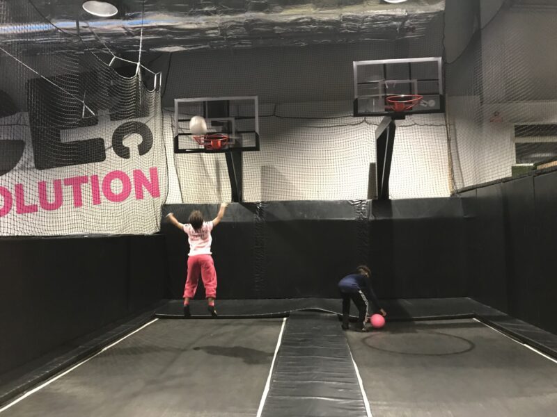 Lovette Jallow playing with Jeanine's children, providing them comfort and joy while Jeanine rests